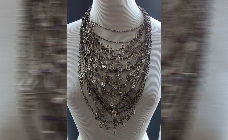 A multiple chain necklace made out of safety pins 