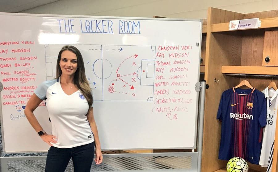 Kay Murray standing in front of a whiteboard 