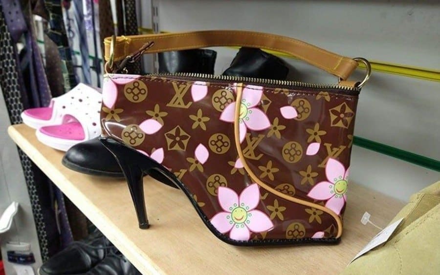A purse with a design that has a lady shoe