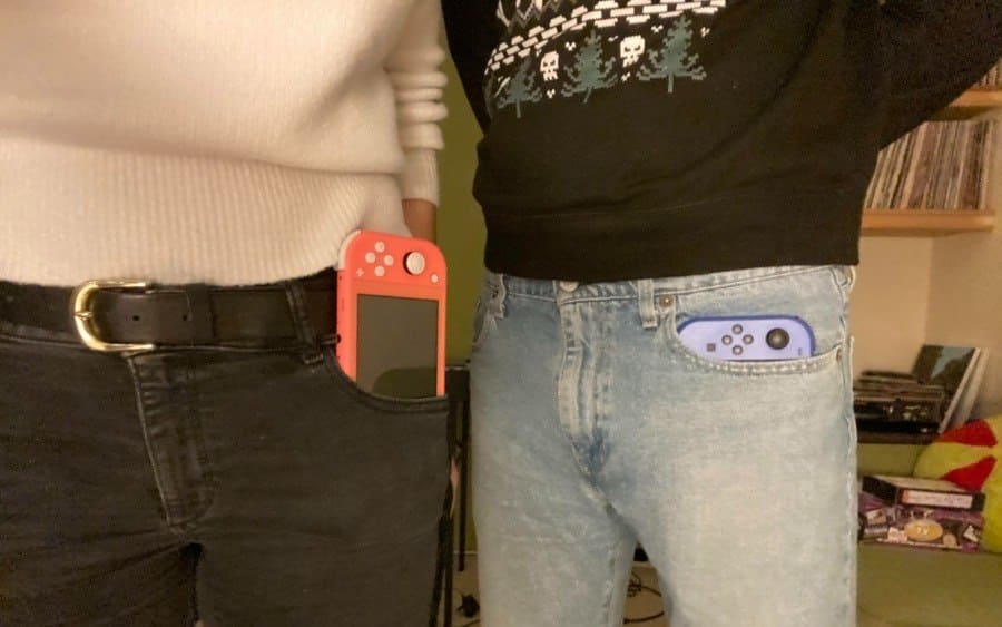 A man and a women side by side with a phone in their pocket