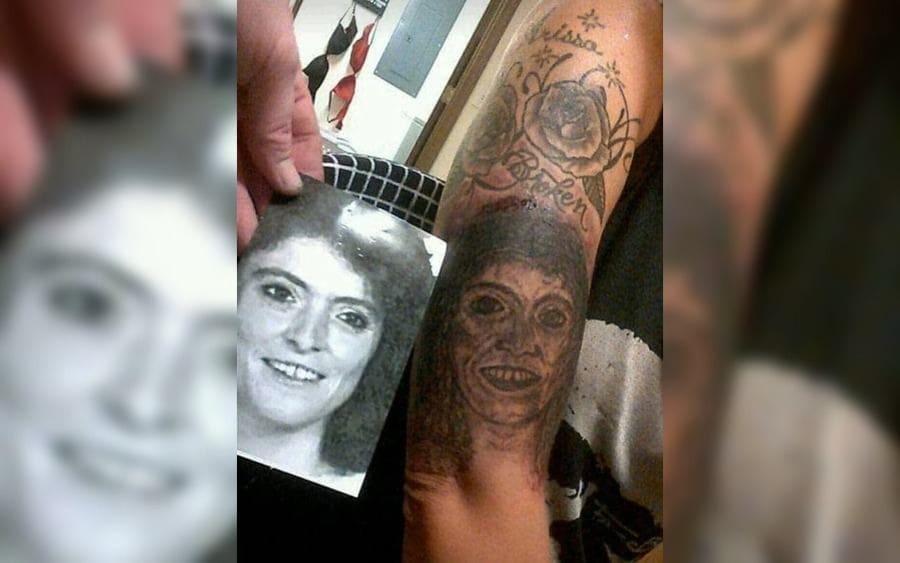A Tattoo of a girl's face on somebody's arm