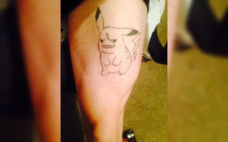 A tattoo of Pikachu on a guy's arm