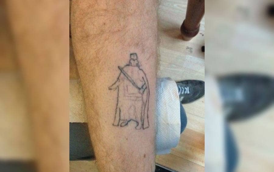 A tattoo of Darth Vader on a guy's arm
