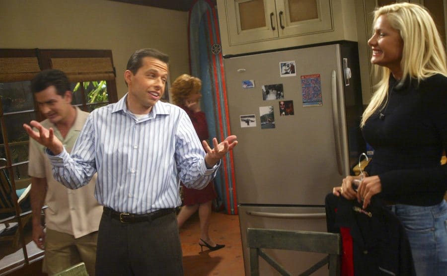 Jon Cryer talking to Janelle Pierzina in the kitchen on the set of Two and A Half Men 