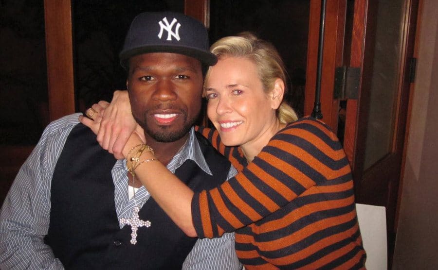 50 Cent and Chelsea Handler hugging him for a photograph