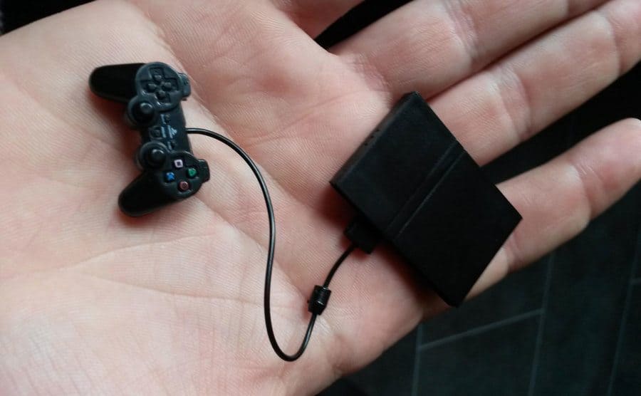 A miniature-sized PlayStation with a controller that fits in the palm of your hand. 