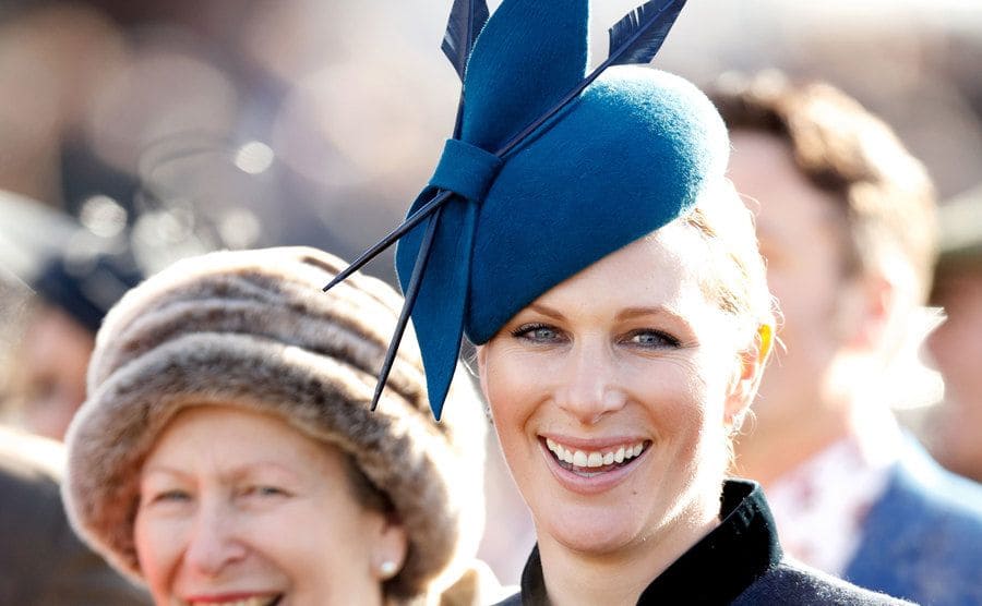 Zara Tindall with Princess Anne in the background at an event 