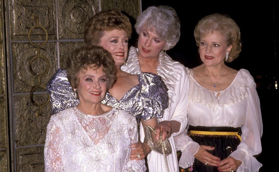 Estelle Getty, Rue McClanahan, Bea Arthur, and Betty White posing together at the 100th episode celebration 