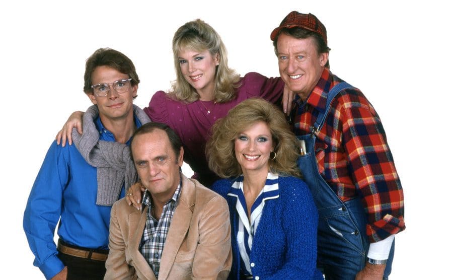 The cast of Newhart posing in front of a white background 