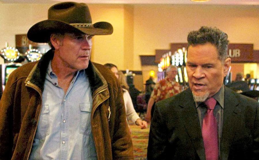 A Martinez and Robert Taylor walking around a casino in a scene from Longmire 