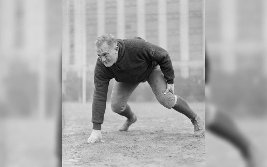 Green Bay Packers football champion, Cal Hubbard, in an offensive line stance.
