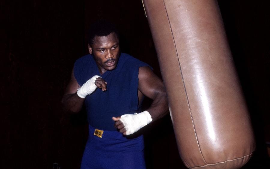 Joe Frazier trains with the punching bag