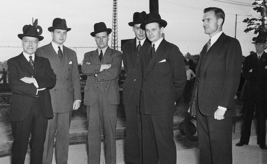 John D Rockefeller Jr and his five sons standing around in top hats 