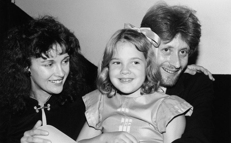 Jaid Barrymore, John Blyth Barrymore, and Drew Barrymore posing together circa 1982 
