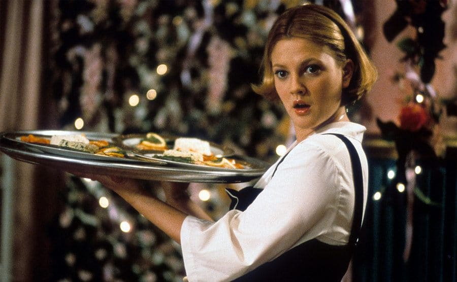 Drew Barrymore waiting tables in a scene from The Wedding Singer 