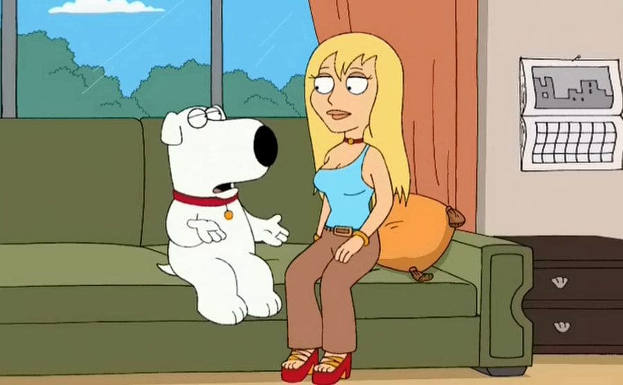 Brian and Jillian sitting on a couch talking in a scene from Family Guy 