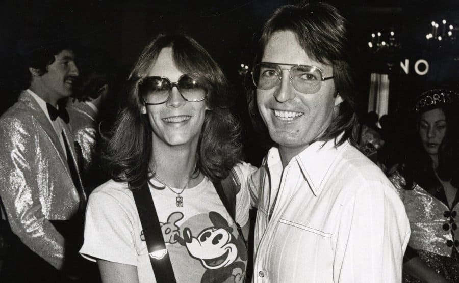 Jamie Lee Curtis and Johnny Lee Schell posing together for a photograph at the airport 