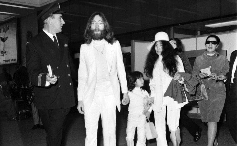 Yoko Ono and John Lennon arriving with their son at the airport 