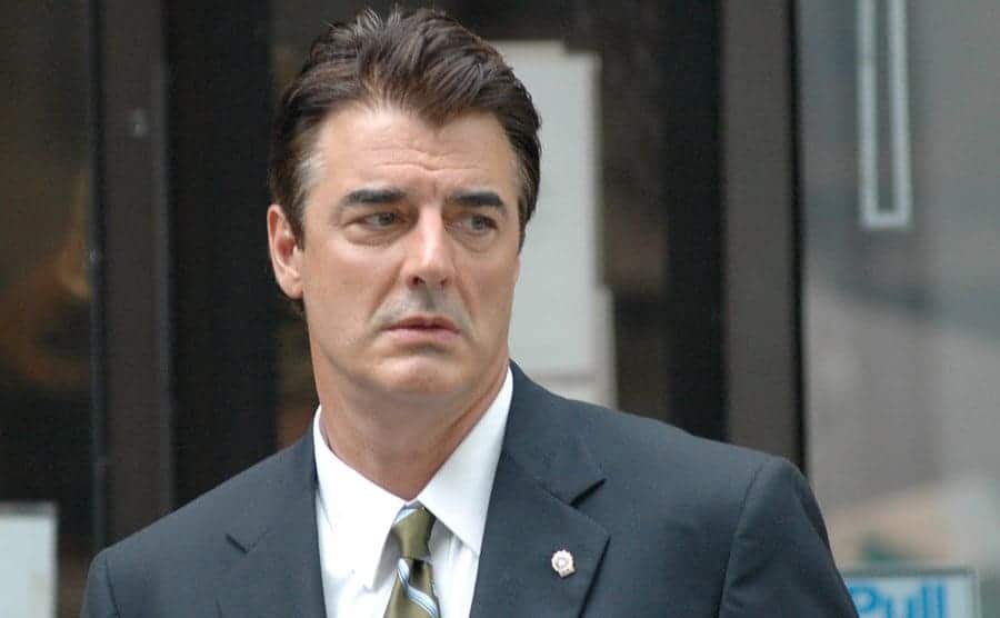 Chris Noth as Mike Logan walking through the streets of New York 