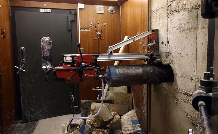 A diamond drill is positioned to drill a hole in the wall used by burglars to access the underground vault of the Hatton Garden Safe Deposit Company.