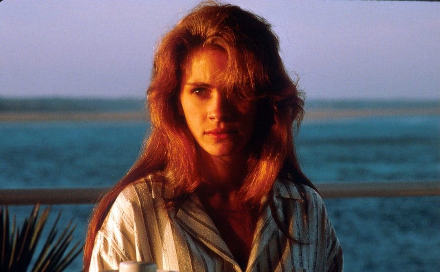 Julia Roberts posing during sunset in front of an ocean view
