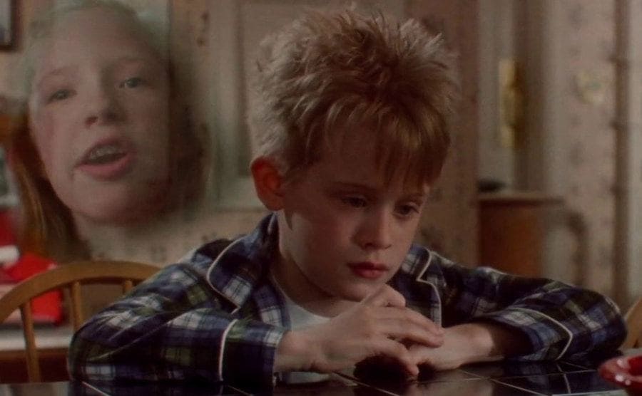 Macaulay Culkin as Kevin having a day dream about his sister with a little cloud with her head inside of it