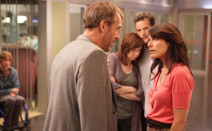 House and Cuddy are arguing in front of hospital patients.