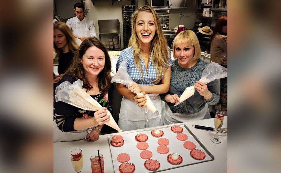 Blake Lively is making macarons alongside two other women. 