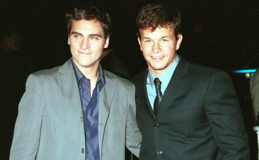 Joaquin Phoenix and Mark Wahlberg posing on the red carpet in 2000 