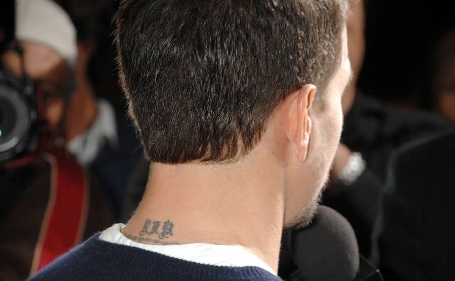 The back of Mark Wahlberg’s head with his tattoo showing 