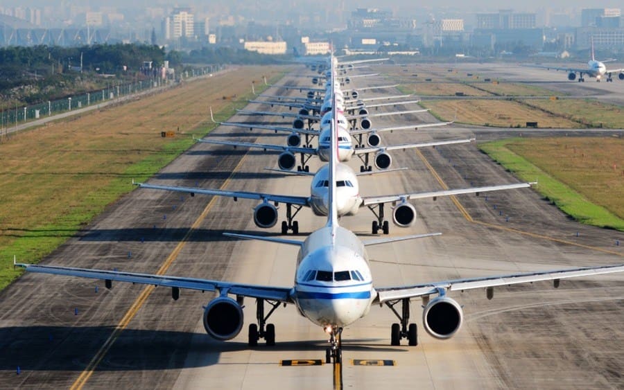 so many airplanes are in line on the runway waiting for take-off