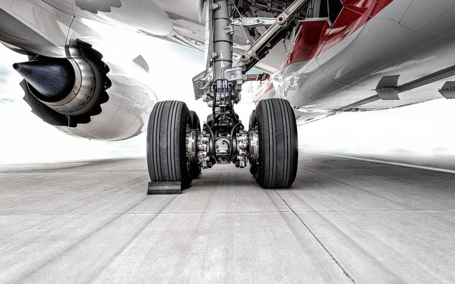 The huge wheels of the plane were parked on the runway of the airport