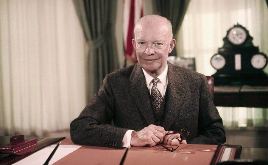 President Eisenhower Sitting at Desk in Oval Office.