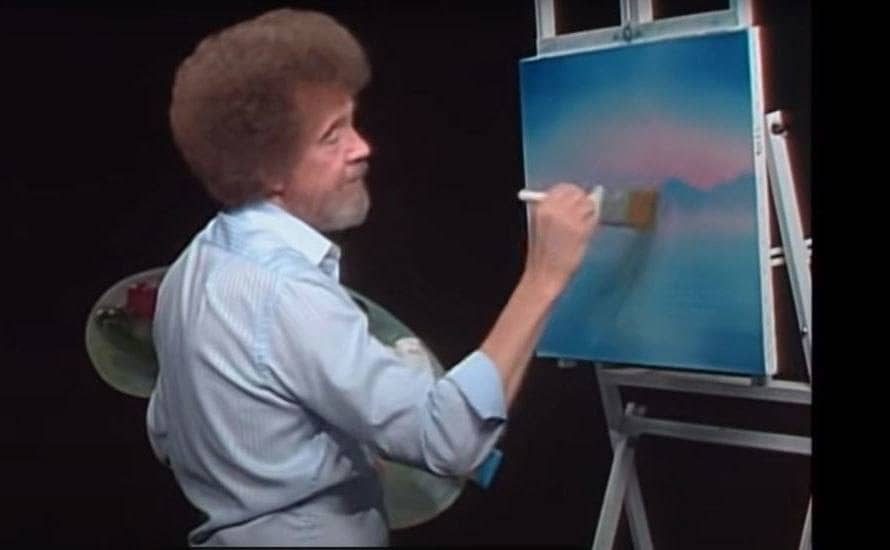 Bob Ross painting a pink and purple skyline 