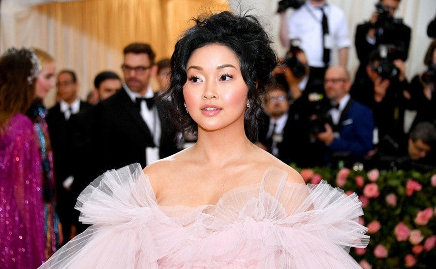 Lana Condor on the red carpet in a fluffy pink dress