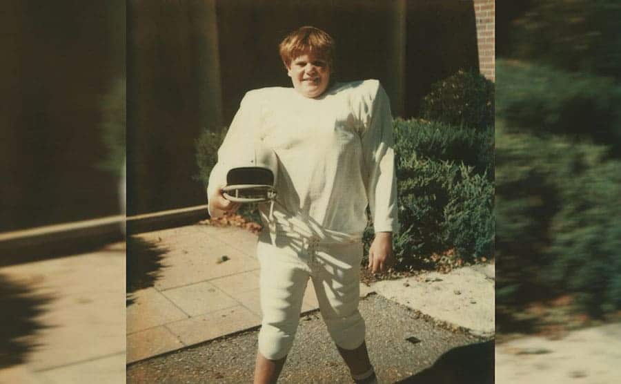 Chris Farley in a football uniform 