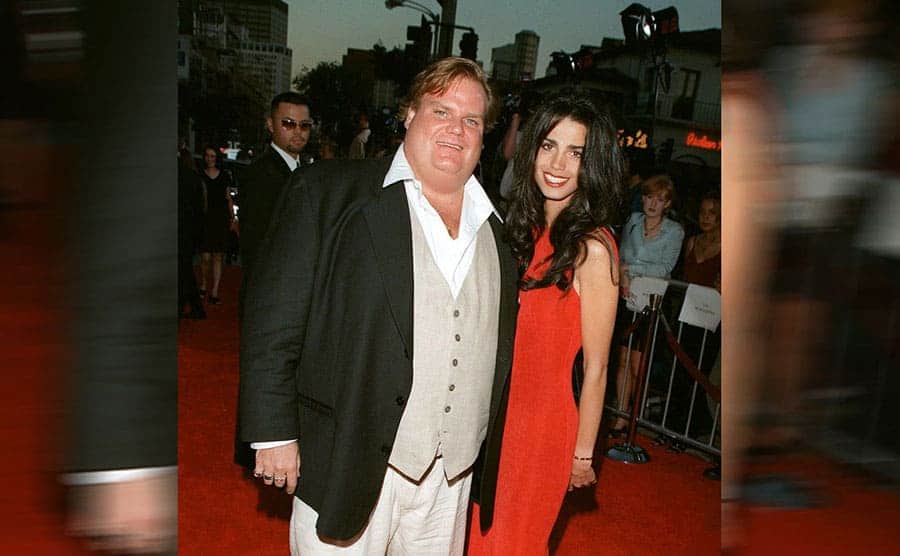 Chris Farley and his date on the red carpet 
