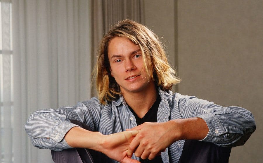 Actor River Phoenix playfully poses during a 1988 Los Angeles, California, photo portrait session.