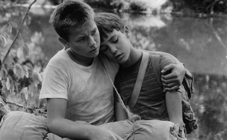 River Phoenix comforts Wil Wheaton in a scene from the film 'Stand By Me,' 1986.