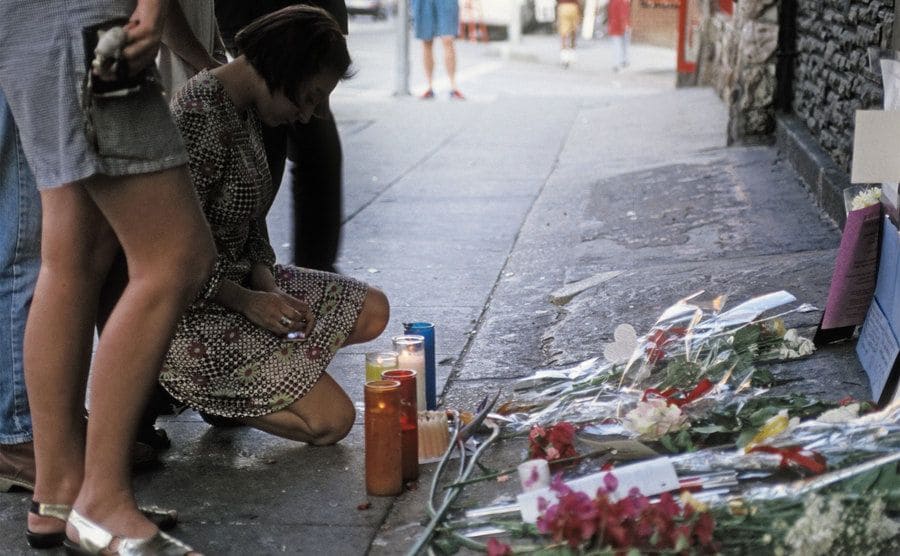 The exterior of The Viper Room the day after the death of actor River Phoenix. Fans are placing flowers, candles, and notes at the spot where he collapsed.