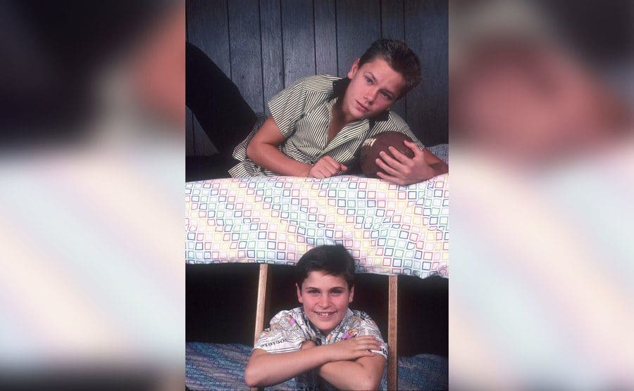 American actors Joaquin and River Phoenix in the bunk bed they shared at their home in Los Angeles, California, US, circa 1985.