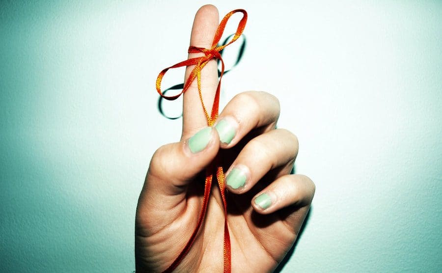 Reminder ribbon tied to finger.