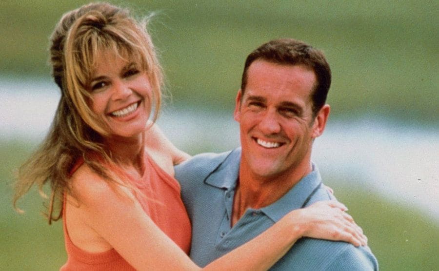 Mary-Margaret Humes and John Wesley Shipp embracing in a photograph for Dawson’s Creek 