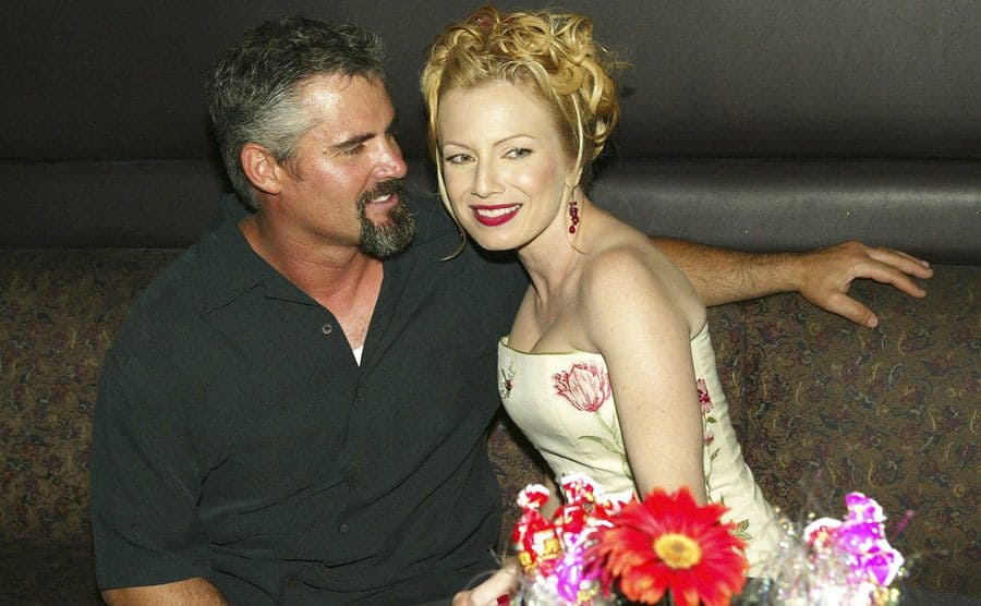 Jeff Lee and Traci Lords sitting at an event 
