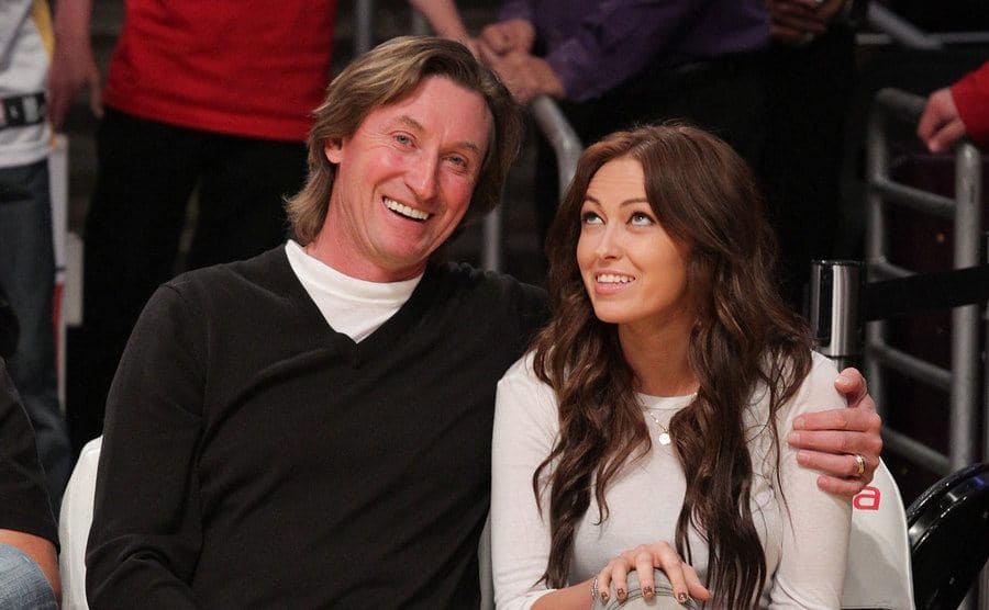 Wayne Gretzky and his daughter Paulina Gretzky attend a game.