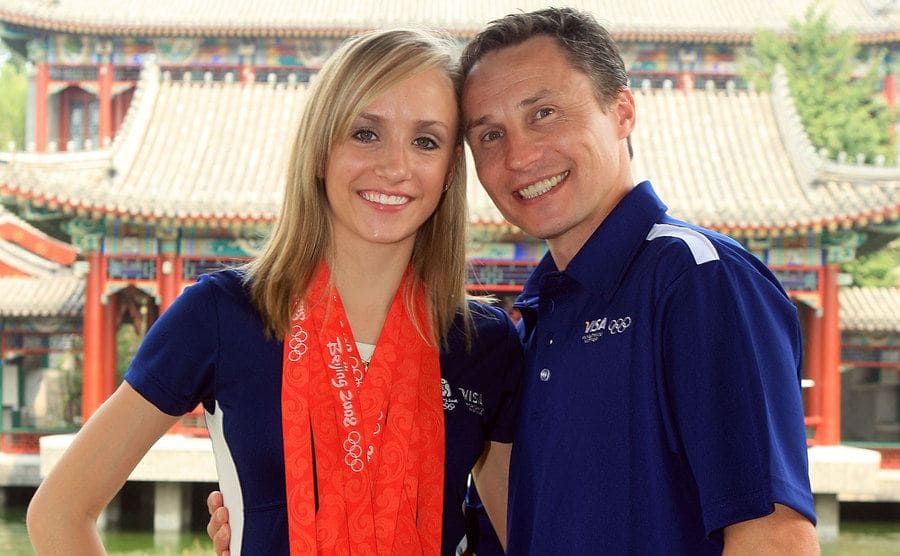 Nastia Liukin with her winning medals and her father and coach Valeri Liukin.