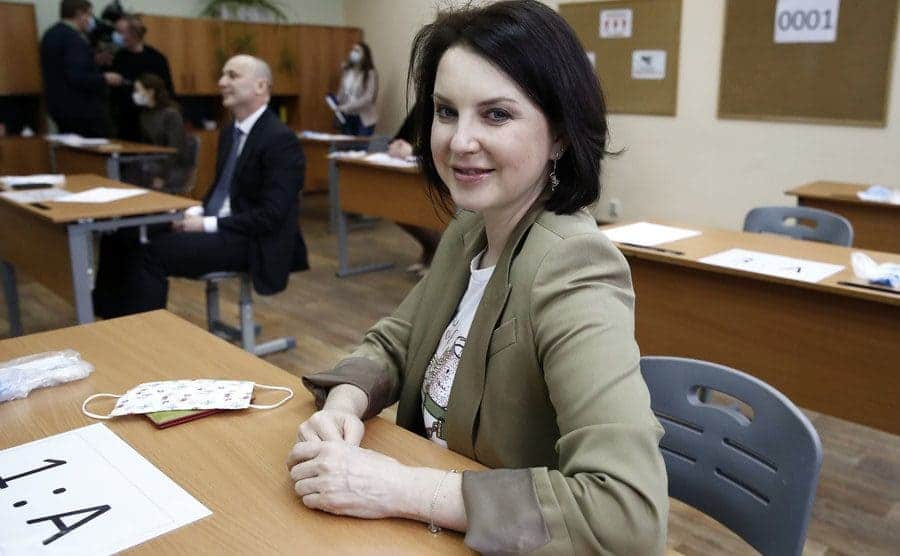 Irina Slutskaya sitting behind a desk in 2021