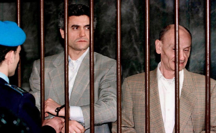 Benedetto Ceraulo and Orazio Cicala behind bars at the trial for the murder of Maurizio Gucci.
