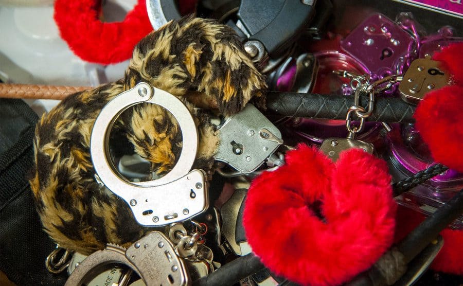 A pile of handcuffs, both metal and furry.