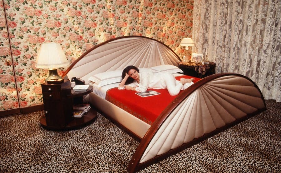 Diane Von Furstenberg reclining in her bedroom at home 1978